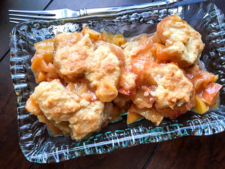 fresh peach cobbler on a plate recipe image 