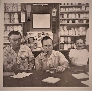 Conrad Farm first in 1900's with the original gifts and canned foods in back of Marvin Conrad at farm store
